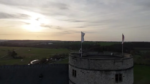 Sunset flags above the tower in evening wind Stock Footage 331210183