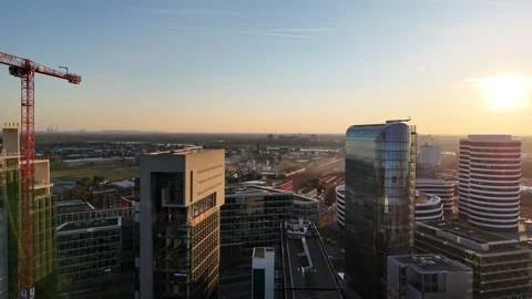 Sunset flight between high rises with lens flare Stock Footage 331196500