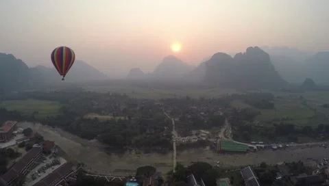 Sunset flight with hot air balloon Stock Footage 51853150