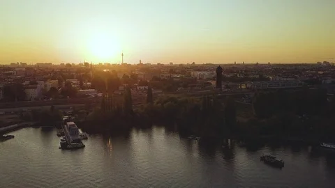 Sunset flight over Berlin at "Rummelsburger Bucht" towards the city centre Stock-Footage 75827228