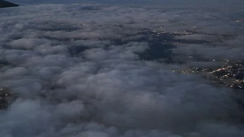 Sunset Flight Over a Bustling Metropolitan City Near Twilight Stock Footage 316796501