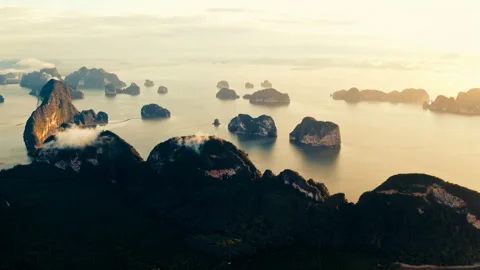 Sunset flight over mountains and ocean Stock Footage 297087837