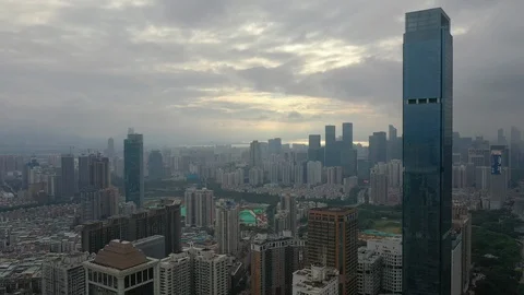 Sunset flight over shenzhen cityscape downtown aerial panorama 4k china Stock Footage 107642745