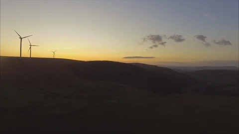 Sunset Flight Over Valley with Wind Turbines Stock Footage 117991661