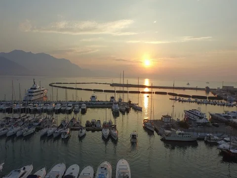 Sunset Flight on sailboats at the harbor Stock Footage 72334611