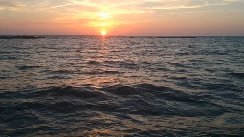 Sunset flowing over the sea Stock Footage