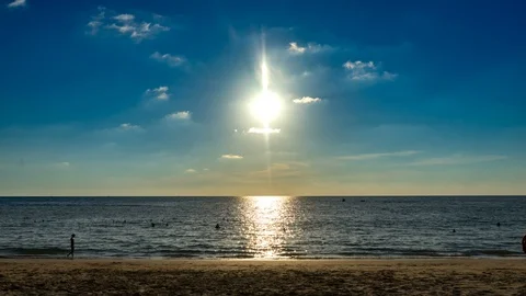 Sunset with fluffy clouds over Surin Beach in Phuket, Thailand Stock Footage 115134153