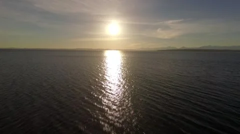 Sunset Flying at Sun Across Puget Sound Washington Stock Footage 60111358
