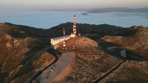 SUNSET WITH FOGS IN MOUNTAIN WITH ANTENNAS Stock Footage 165992013