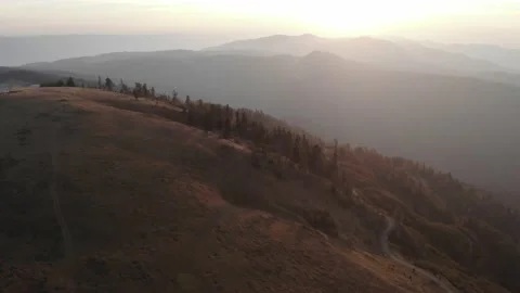 Sunset from forests and mountains Stock Footage