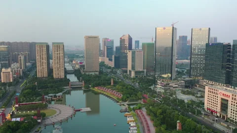 Sunset foshan downtown famous park lake square aerial panorama 4k china Stock Footage