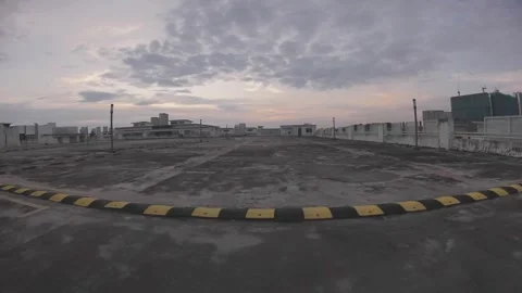 Sunset FPV Drone Flyaround Over Kuala Lumpur Rooftop Parking 01 Stock Footage 303755016