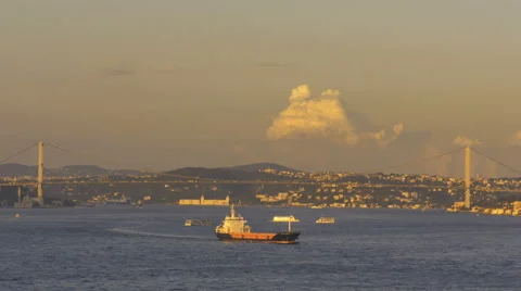 Sunset freighter ferries bridge over Bosphrus Strait Istanbul Turkey Stock Footage 61896291