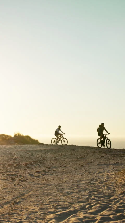 Sunset, friends and exercise outdoor with mountain bike, fitness and helmet for Stock Footage 340400746