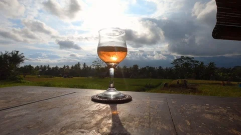 Before sunset a glass of rose wine. Stock Footage 102059017