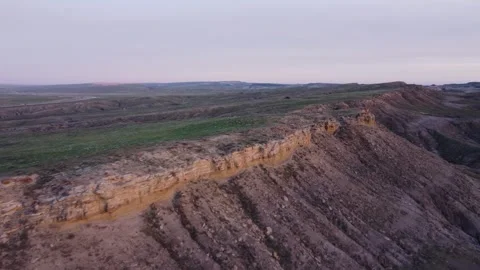 Sunset glow butte fly along ridge Stock Footage 310574904