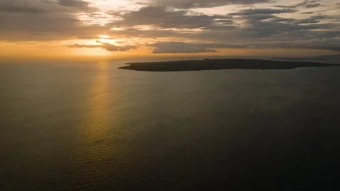 Sunset glow on calm ocean waters. Romblon, Philippines. Stock Footage 311786301