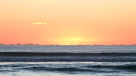 Sunset glow emerging over Atlantic wave horizon Video stock 329205179