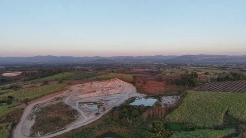Sunset Glow Over Mountains and Quiet Fields Stock Footage 325686770