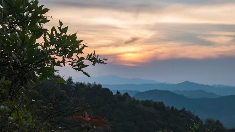 Sunset Glow Over Rolling Mountain Ranges During A Calm Summer Evening Stock Footage 342096044