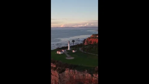 Sunset Glow on Palos Verdes Cliffs and Lighthouse Stock Footage 328065138