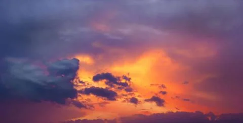 Sunset glow Sunset amid thunderclouds. Sunset shines red through dark clou... Stock Photos