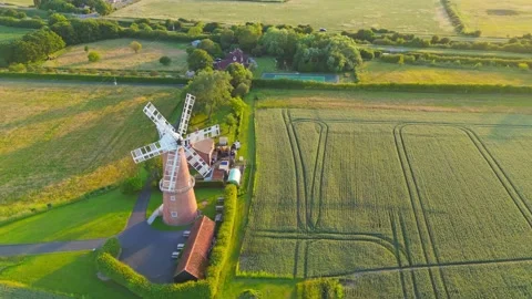 Sunset glows over ancient windmill, serene and proud 스톡 동영상 342614779