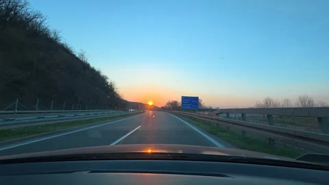 Sunset glows over empty highway. Balkan, Eastern Europe, POV Video stock 331455593