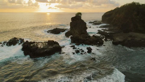 Sunset glows over rocky Ostional beach on Pacific coast of Costa Rica Video stock 343171845