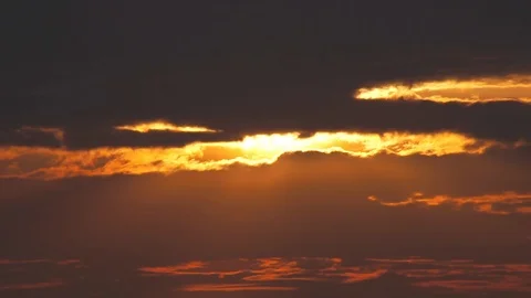 Sunset going behind dark clouds. Video stock 91435259