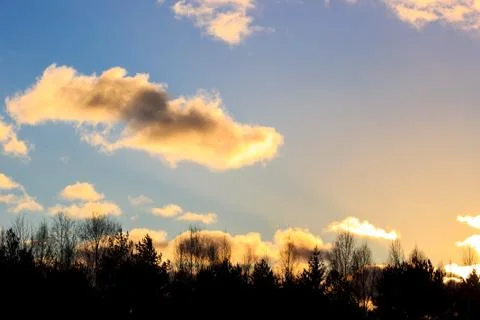 Sunset with gold clouds Stock Photos