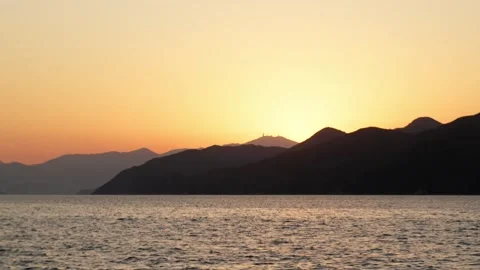 Sunset golden hour scene shot from ferry in Hong Kong - 4k Stock Footage 297870168