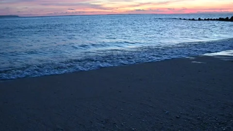 Sunset golden hour view of beach with orange sky 4K video Stock Footage 238864969