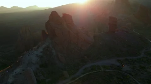 Sunset golden light illuminating Roques de García rock formations in Teide Stock Footage 345533999