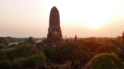 Sunset golden rays illuminating wat phra ram temple, of Ayutthaya historical Stock Footage 310870946