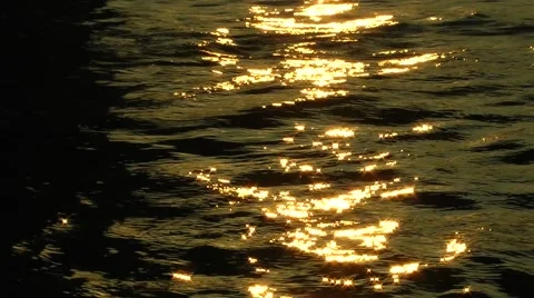 Sunset golden rays of light on waves Stock Footage 46809577