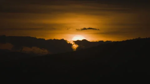 Sunset on golden sky over mountain background Stock Footage 246874872
