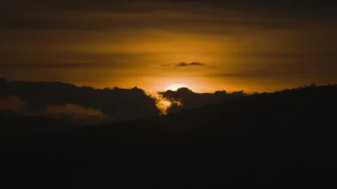 Sunset on golden sky over mountain background Stock Footage 246875252