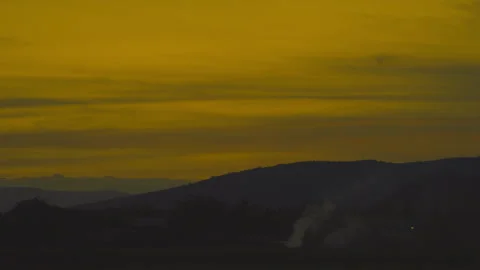 Sunset on golden sky over mountain background Stock Footage 246877345