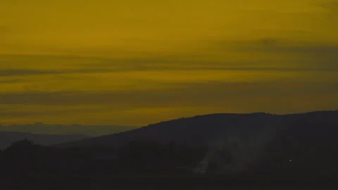 Sunset on golden sky over mountain background Stock Footage 246877981