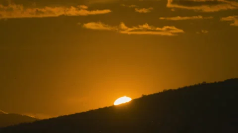 Sunset on golden sky over mountain background Stock Footage 246893014