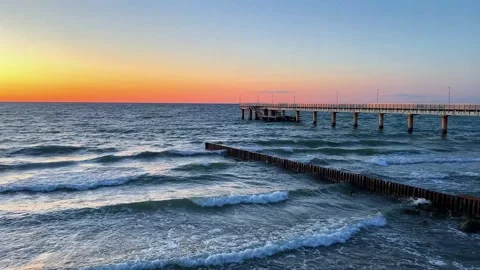Sunset gradient from blue to orange above blue ocean water. Meditation content Stock Footage 314597443