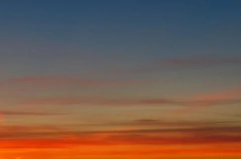 Sunset gradient from blue to orange Stock Photos