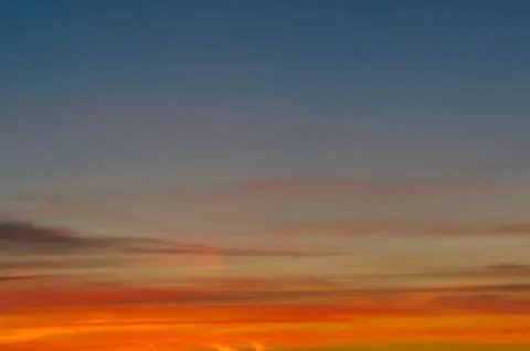 Sunset gradient from blue to orange Stock Photos
