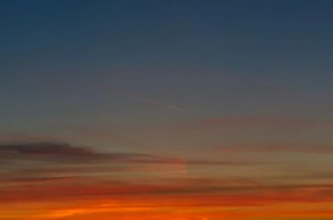 Sunset gradient from blue to orange Stock Photos