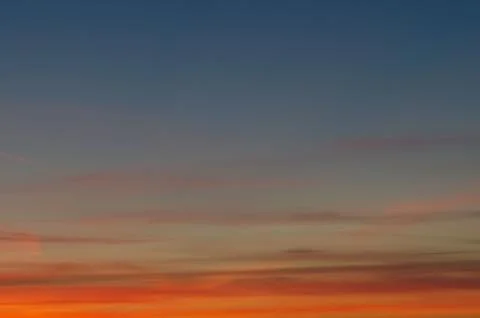 Sunset gradient from blue to orange Stock Photos