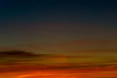 Sunset gradient from blue to orange Stock Photos
