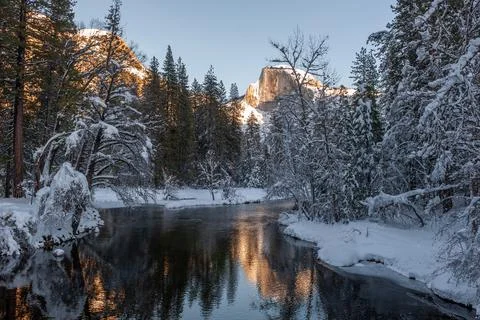 Sunset at Half dome reflected in the merced rivier Stock Photos