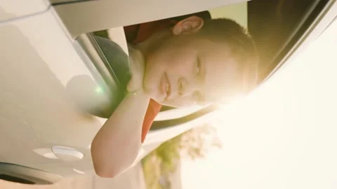 Sunset hand movement, windy breeze hand sun rays, traveling by car van, child Stock Footage 288223083