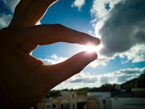 Sunset hand shrink sun Stock Photos